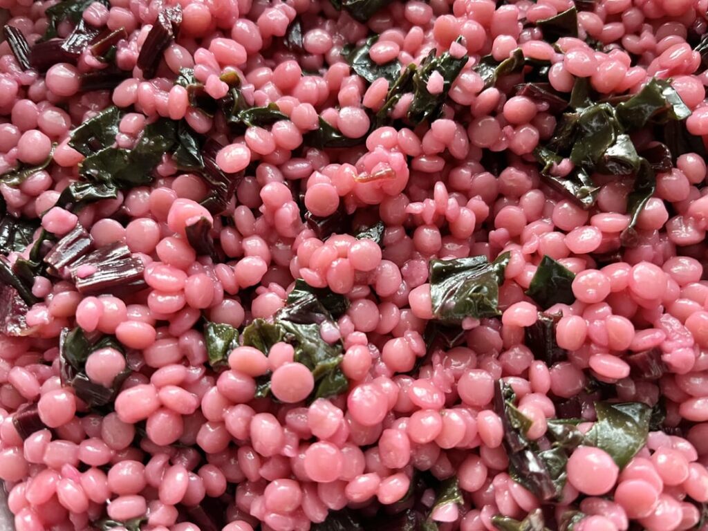 Whole-Wheat Pearl Couscous sauté with Beet stems and greens.