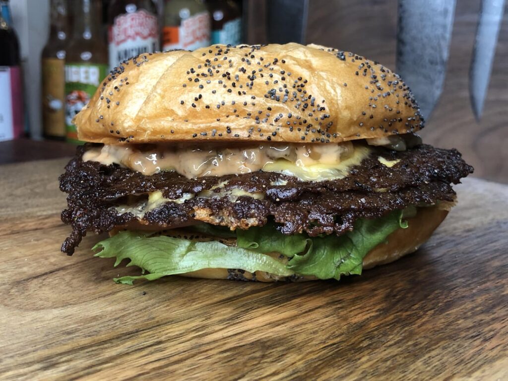 Burger night! Two home ground smash patties with American, lettuce, tomato, lots of caramelized onions, and homemade burger sauce.