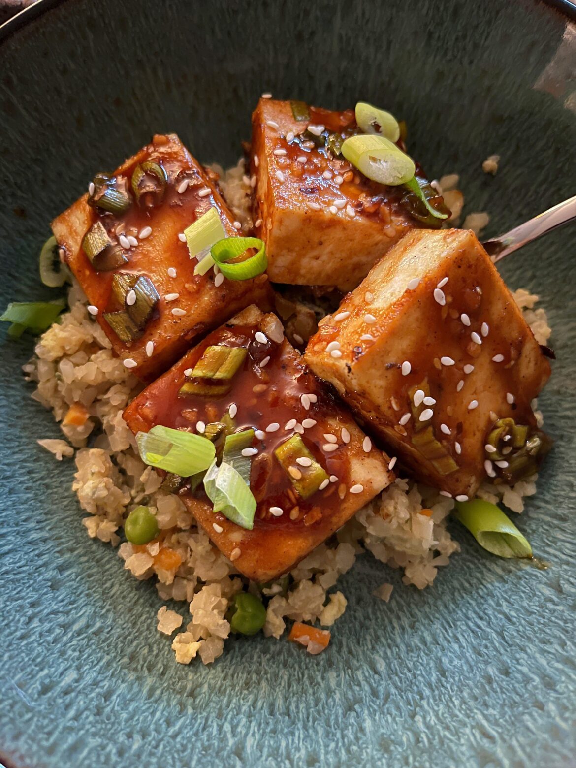 Sriracha teriyaki baked tofu over cauliflower fried rice