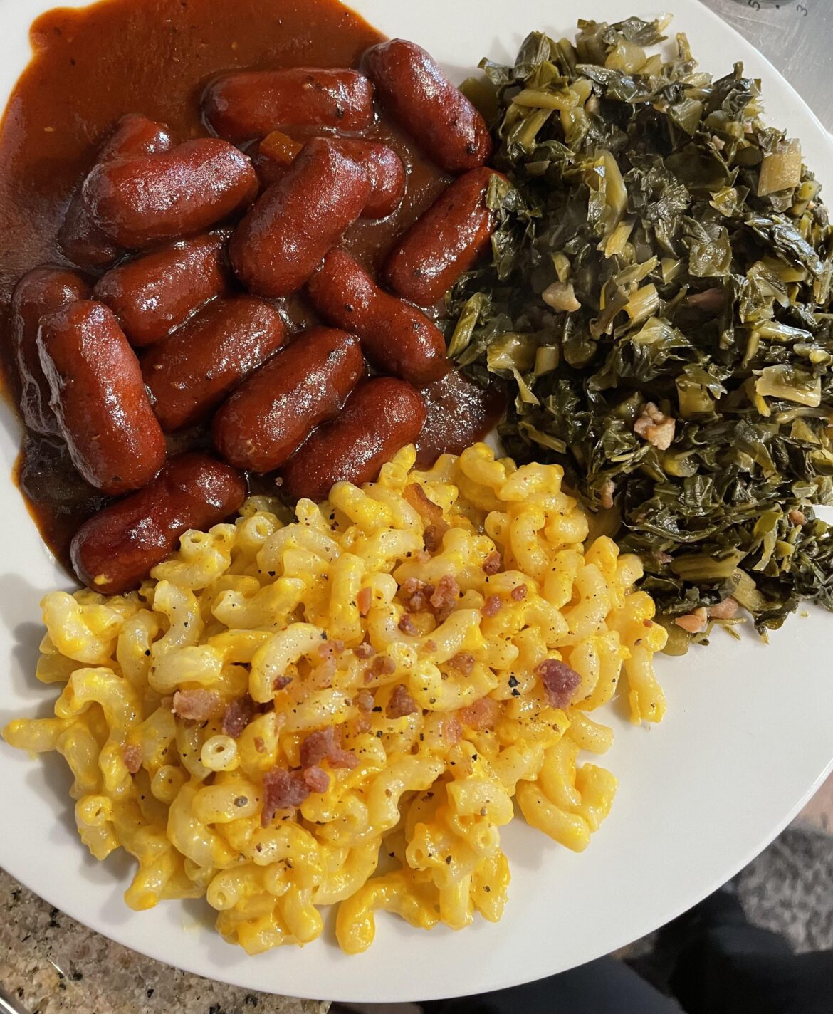 Made lil smokies in the slow cooker with Famous Dave’s Texas pit BBQ sauce and diced onions and jalapeños. Plus mac and cheese and collard greens 👍👌