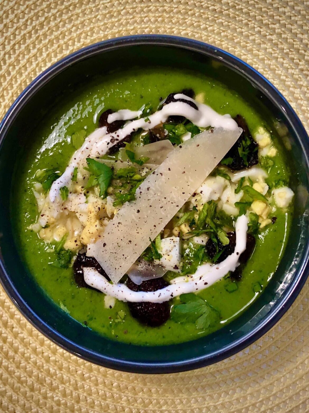 ‘Springtime Soup’ - fresh peas, spinach, kale, arugula, ramps, parsley, mint, and green garlic puréed in veggie broth, topped with roasted morels, egg, crème fraîche, Parmigiano-Reggiano, and lemon.
