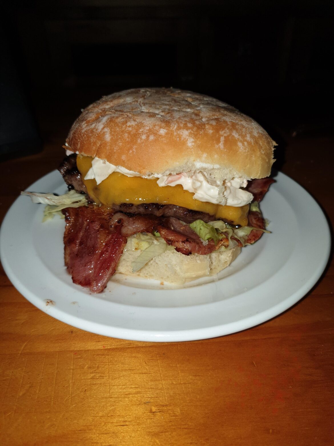 Irish Angus steak burger, Mild Irish cheddar, 2 smoked back rashers, coleslaw on a floury bap. Top tier stuff.