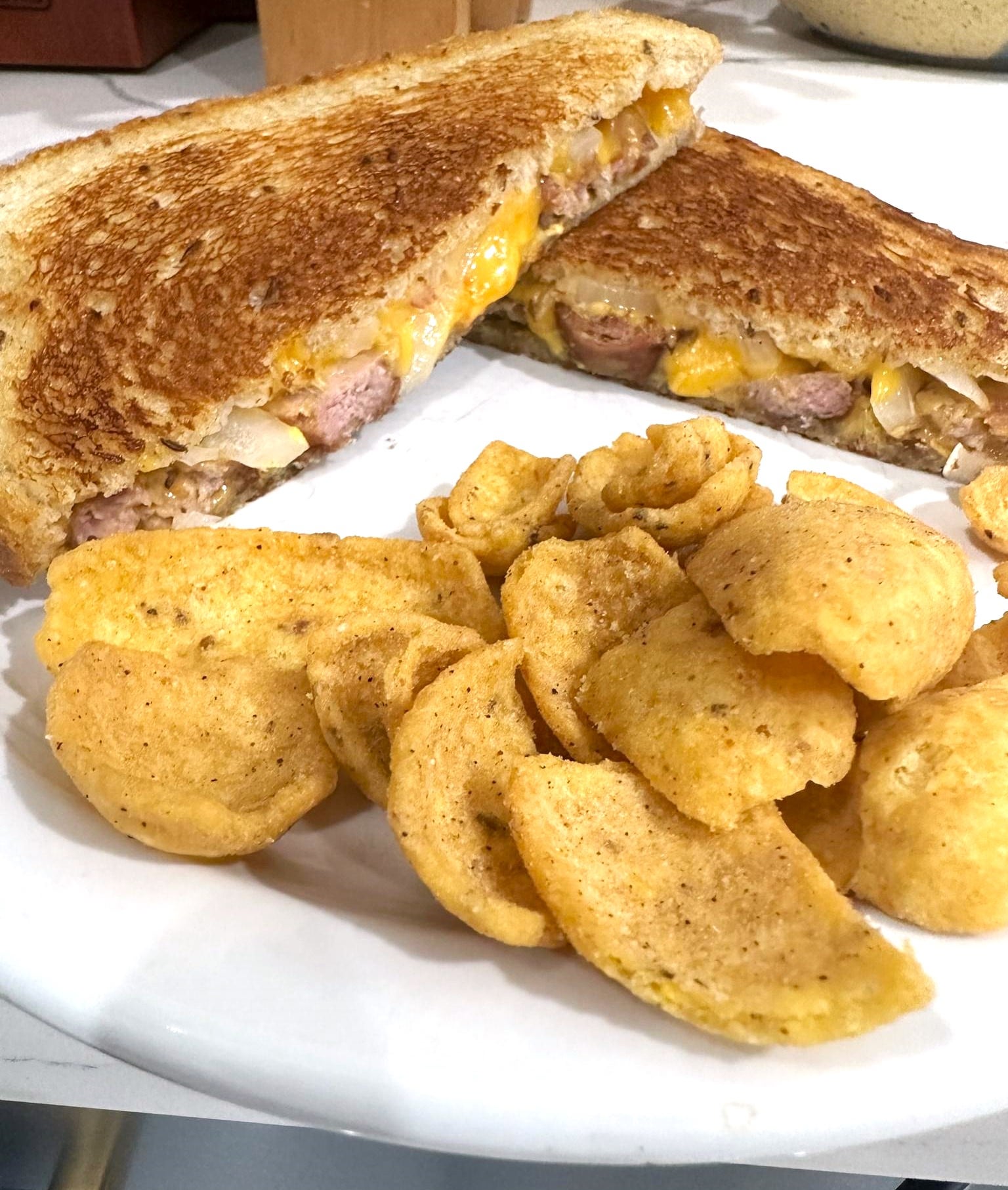 beer brat grilled cheese brat, vermont cheddar, onion and spicy brown