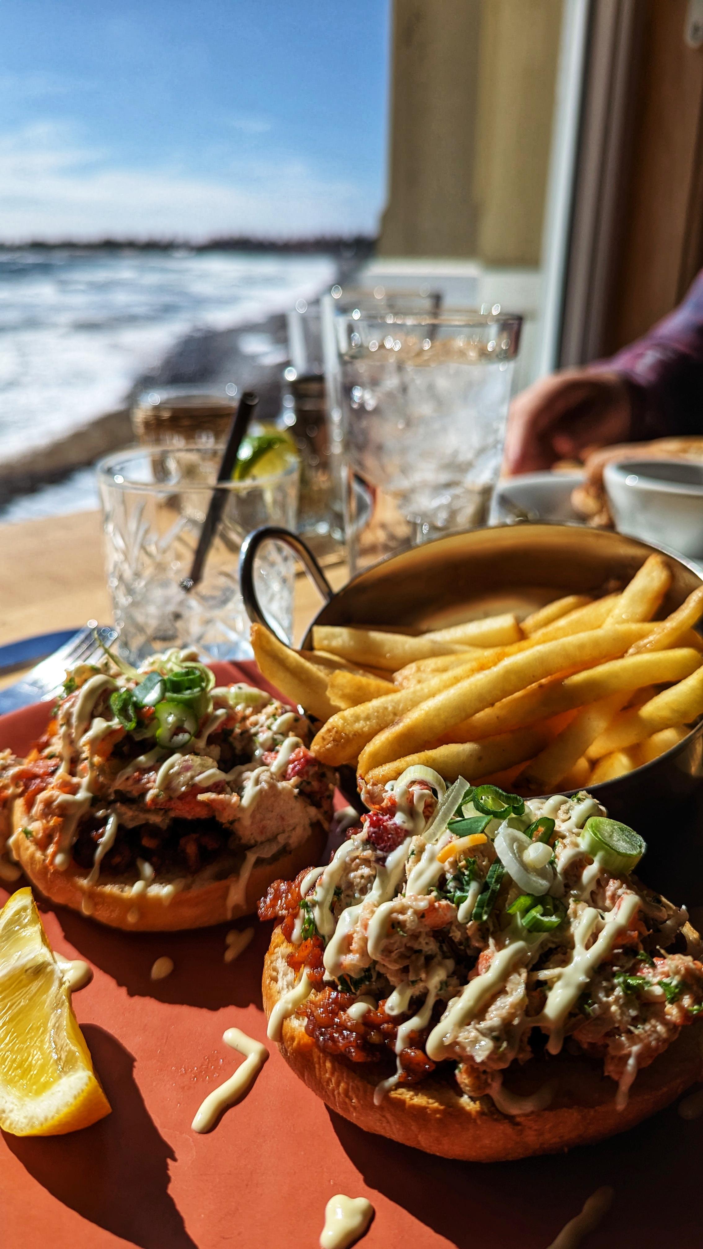 A Nova Scotia lobster "roll" with smoked onions, crema, and house bacon