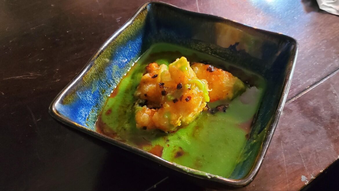 Ramsay's 3 ingredient broccoli soup with fried buffalo cauliflower, topped with soy bean chili crisp.