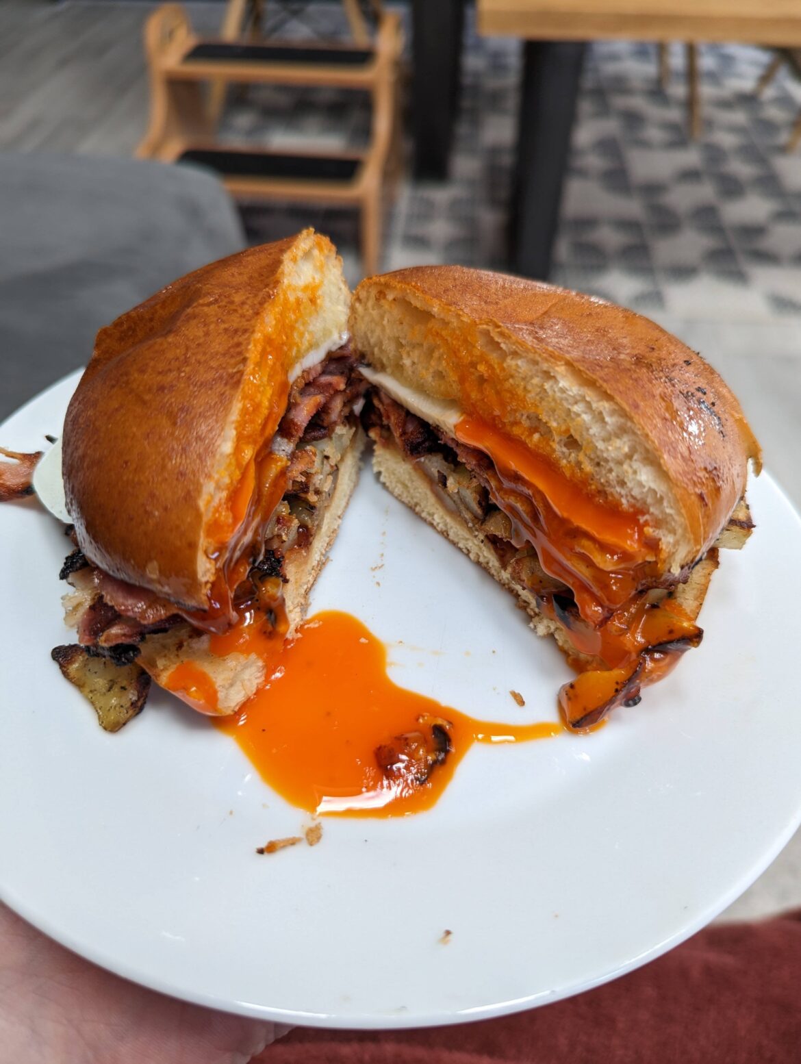 Bacon and egg in a buttered brioche bun toasted on the Big Green Egg. Potato, onion and mushroom medley seasoned with salt, pepper, onion powder and garlic powder.