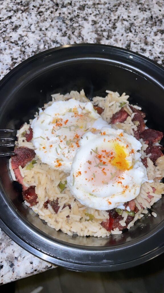 Spicy beef sausage fried rice topped with eggs poached medium. @holistihealth