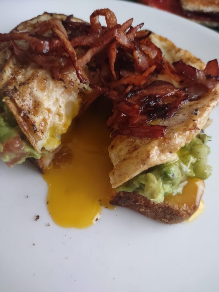 Avocado Toast with crispy ham and that sweet sweet eggy on top.