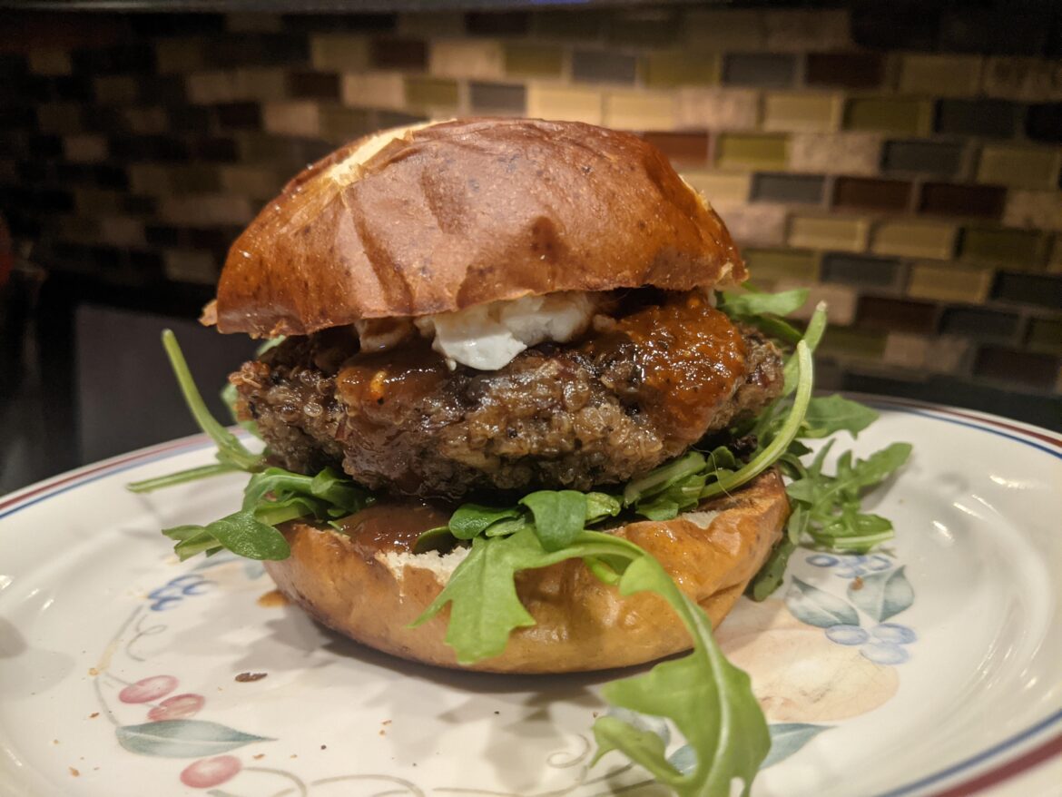 Quinoa and mushroom burger with goat cheese, arugula and BBQ sauce