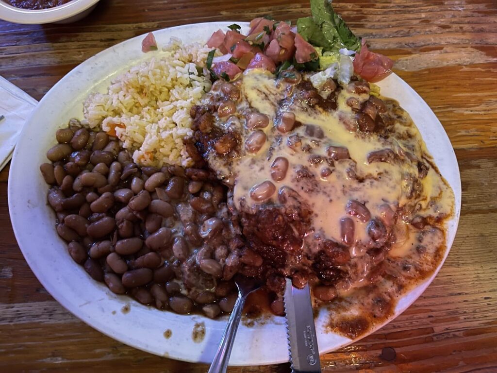 a mad dog w/ the worm, pork chops smothered in queso & habanero beef chili @ Texas Chili Parlor