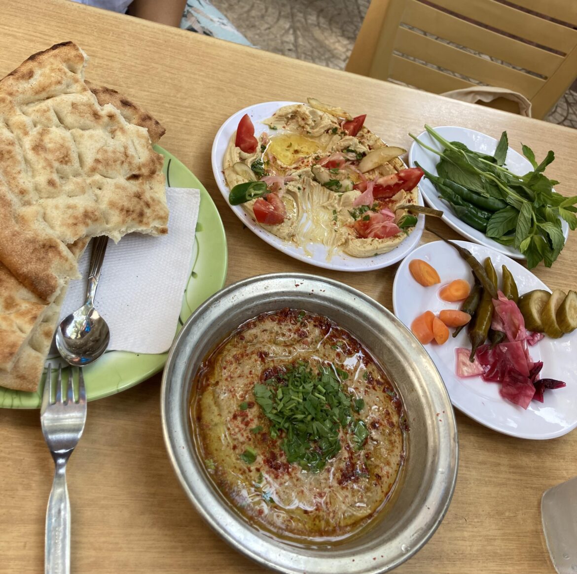 two types of hummus, one with chickpeas and other one with broad beans