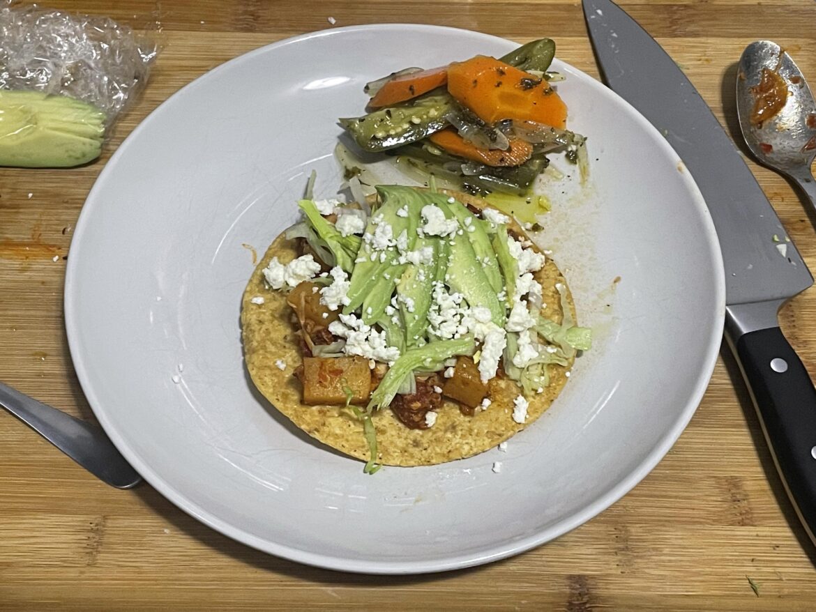 Tinga tostada with pickled vegetables