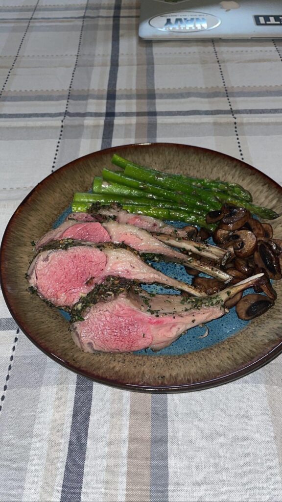 Medium-rare herb crusted rack of lamb.