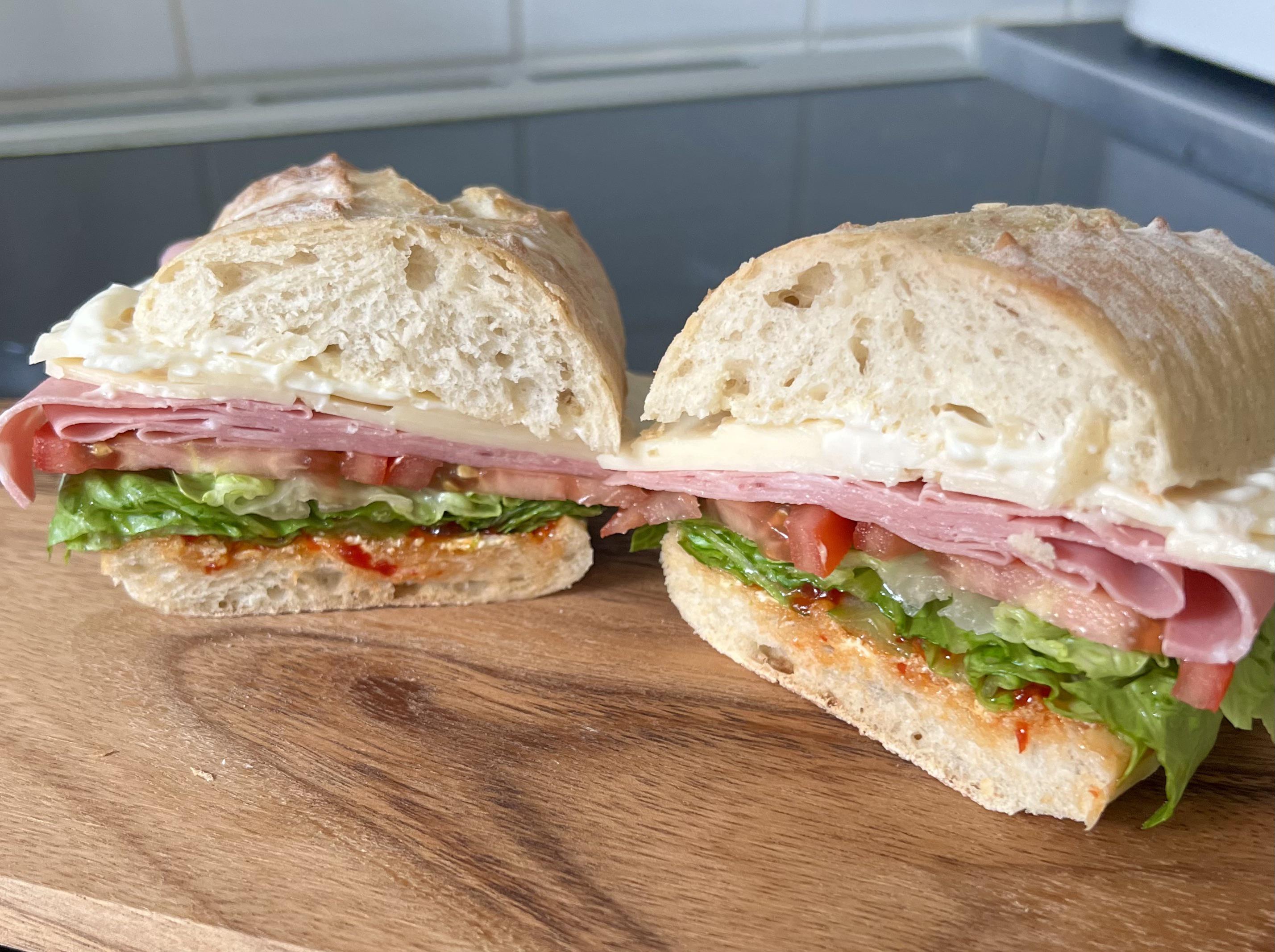 Mortadella, massdam, tomato, lettuce, chili jam, mayo, on sourdough