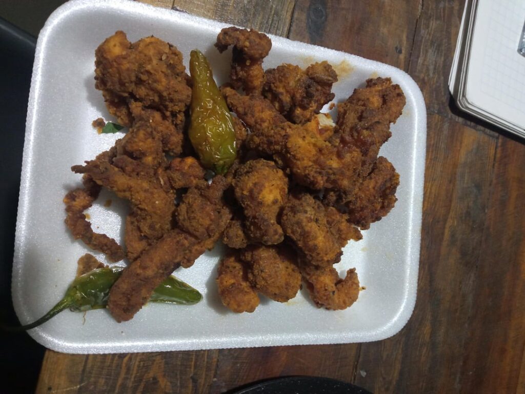 Fish chicarron. The food on the dish is the half of the order. The other half was eaten in several tacos. $5.00 USD Came with tortillas, lime, onion and salsas.