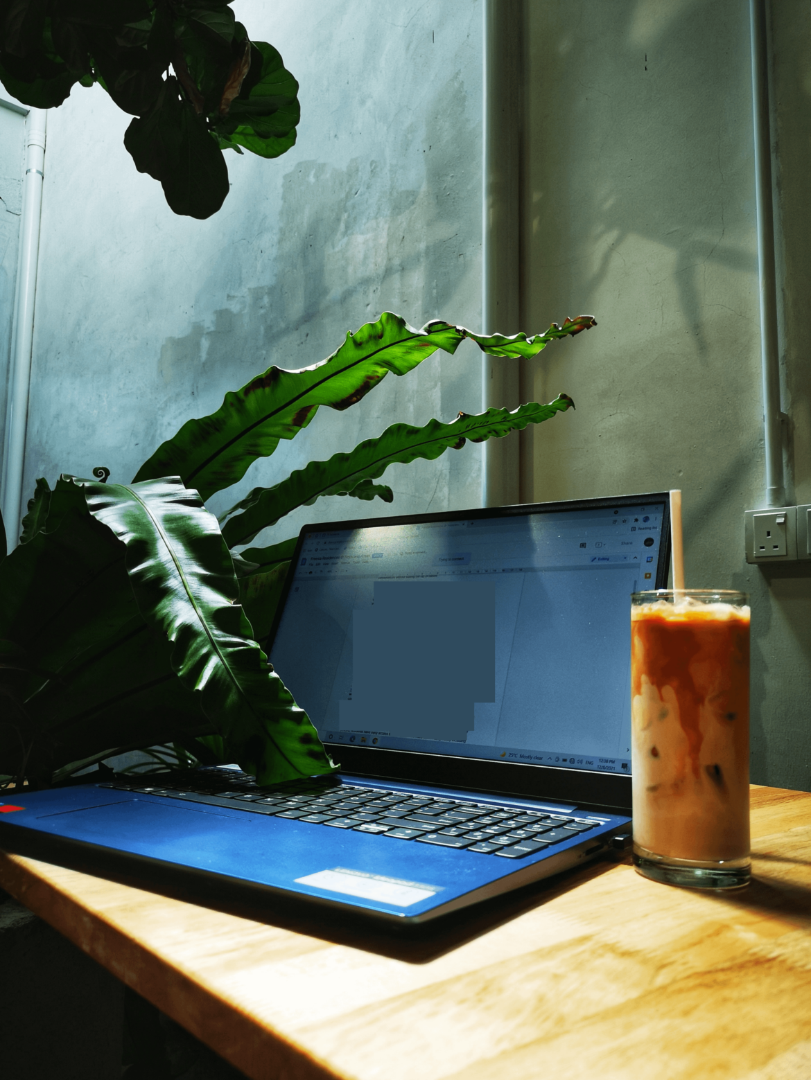 Iced coffee + warm sunshine = The right kind of workspace