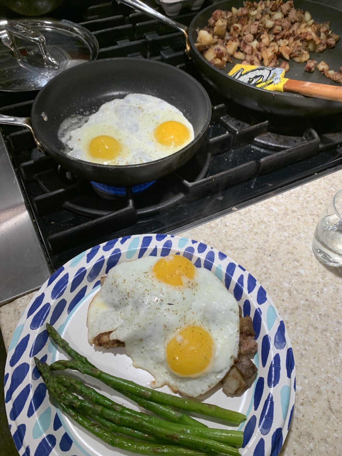 The kids are always down for some breakfast for dinner - kielbasa hash, fresh eggs and asparagus