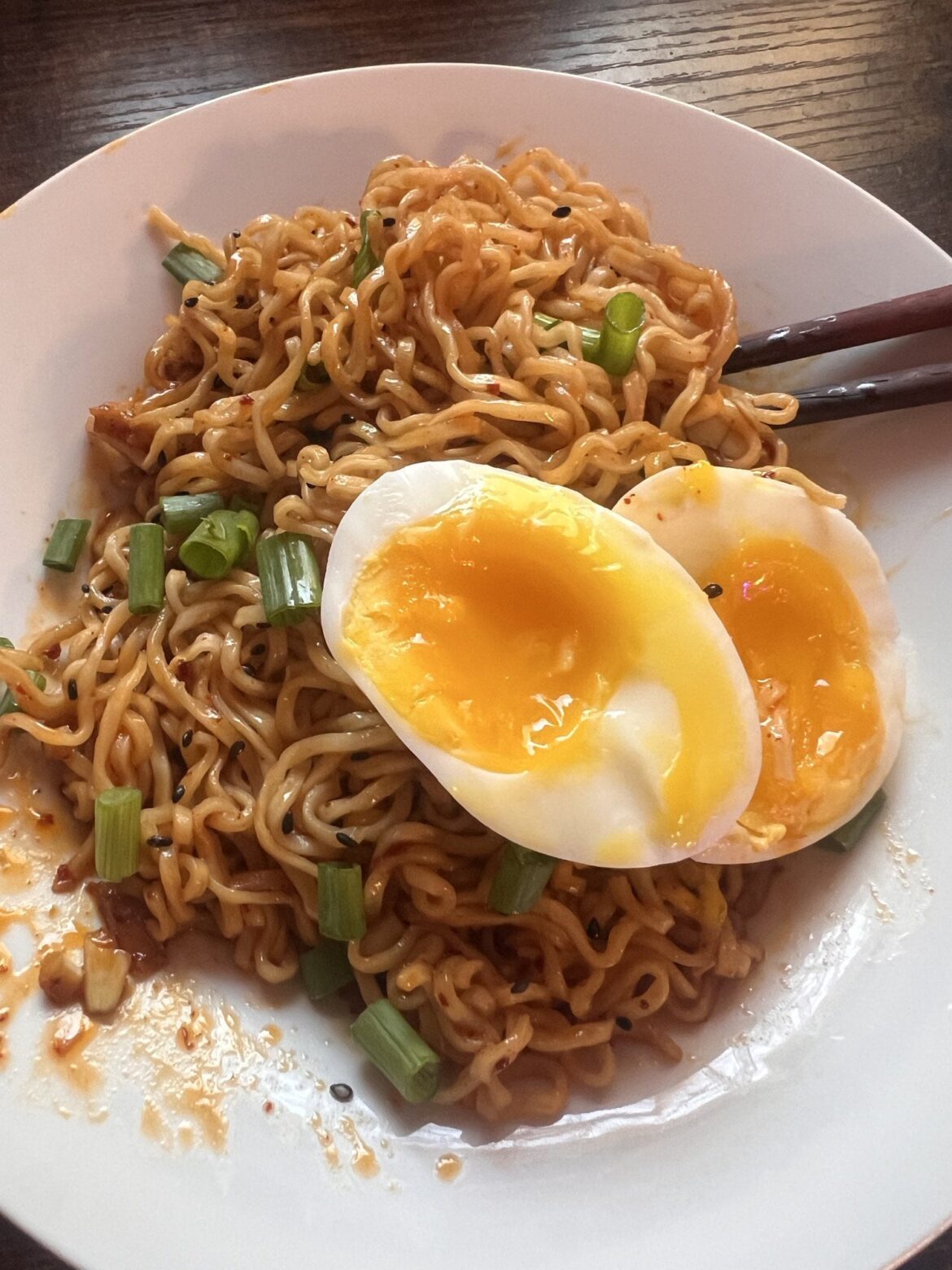 Sichuan butter noods with an egg on it