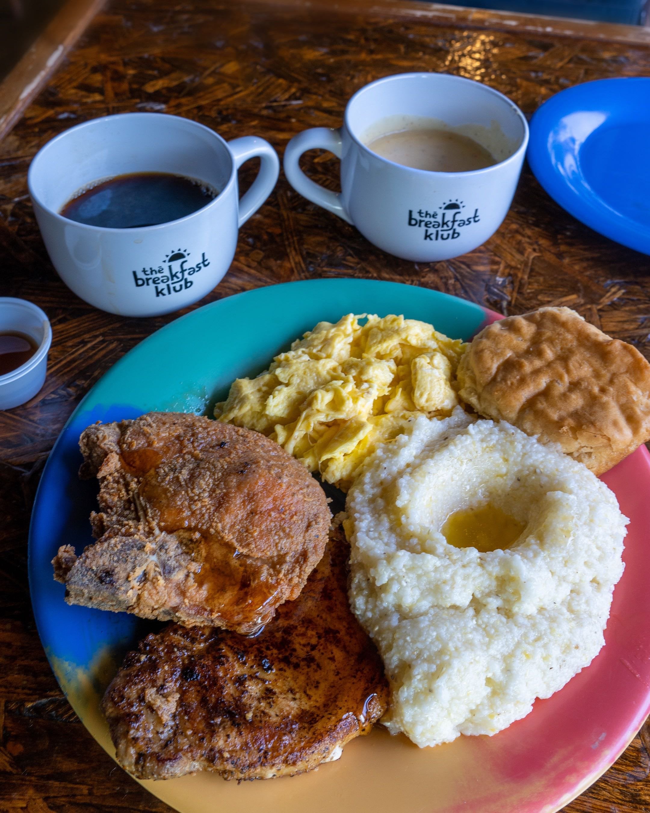 Fried/Grilled Pork Chops, Grits, Eggs, and Biscuit Breakfast Dining