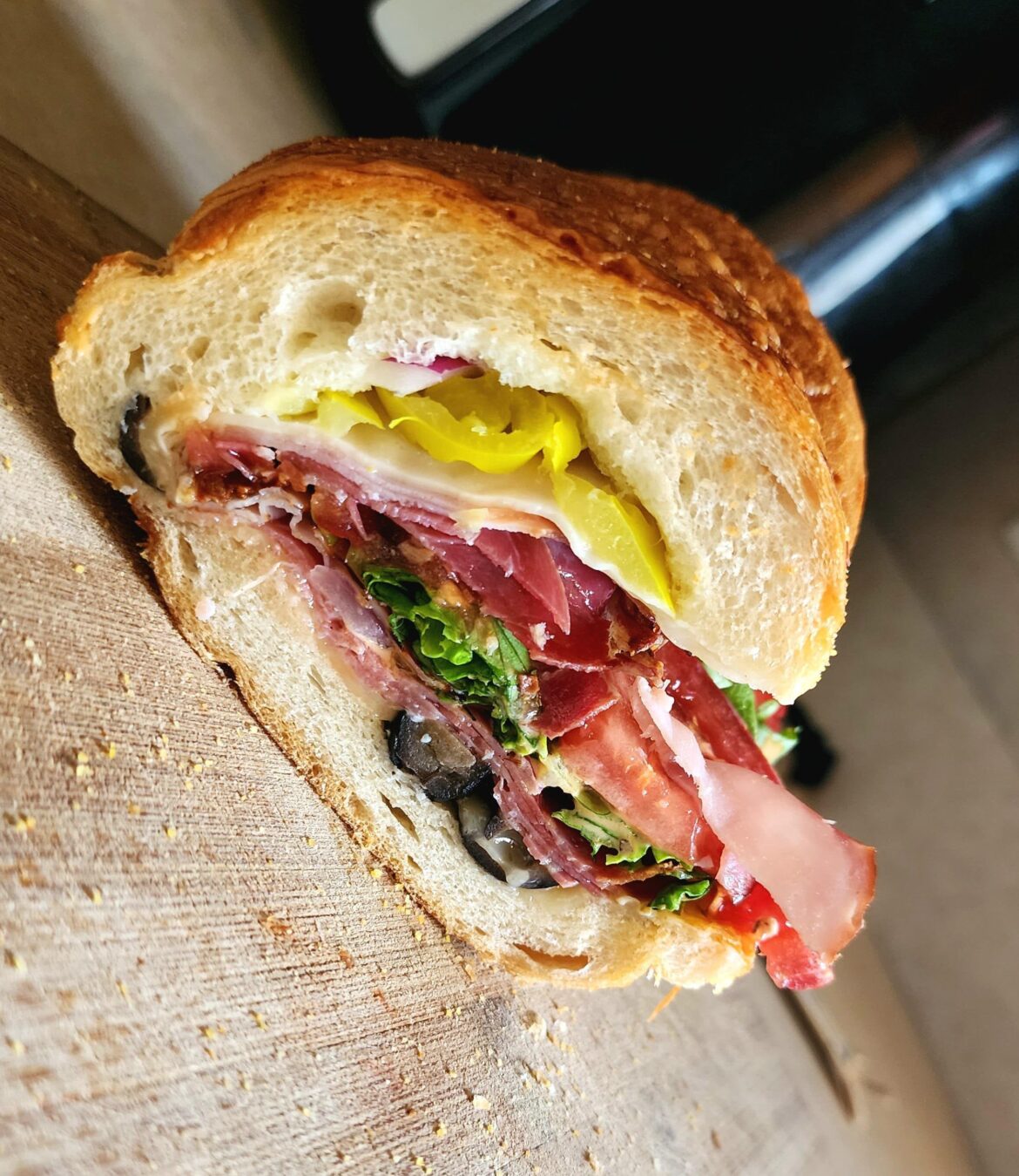 My first itialian sub I made! Capicolla, smoked ham, salami, hot banana peppers, lettuce, tomato, black olives, provolone and Carolina reaper cheese.