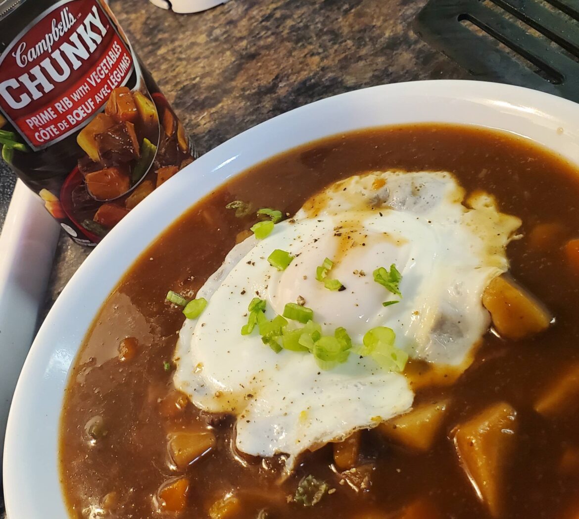 Canned stew with an egg on it.