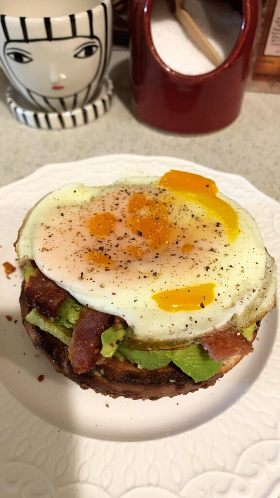 Put an egg on an Asiago bagel with avo & bacon :)