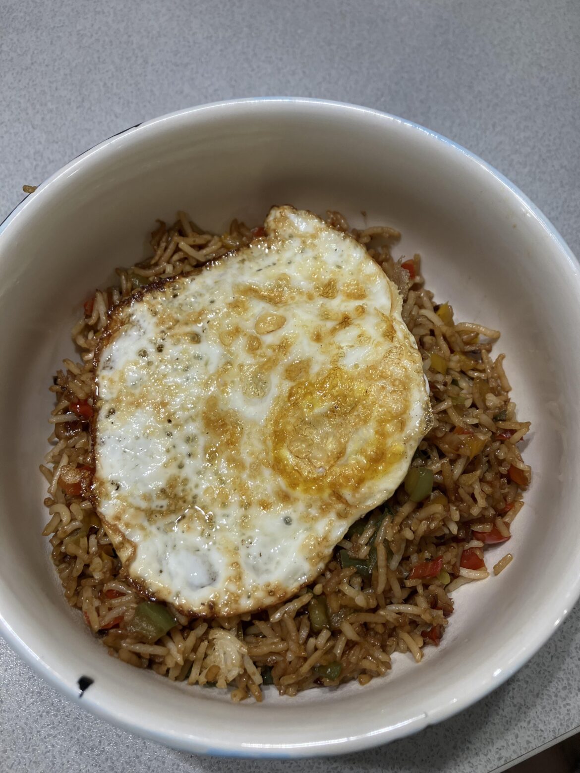 The picture doesn’t do justic to the fried egg on top of fried rice 😋