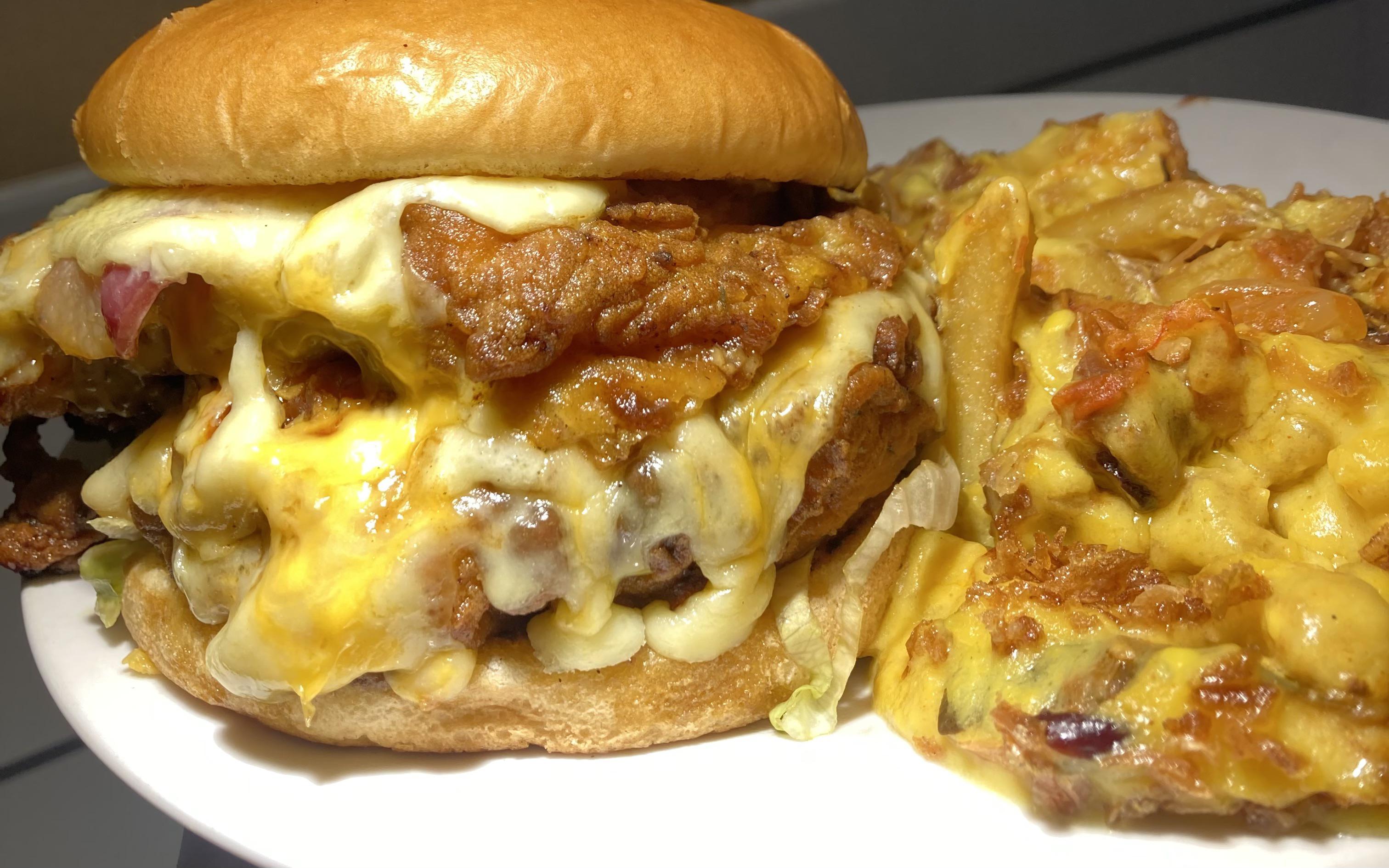 Double chicken and bacon cheese burger with pulled brisket loaded