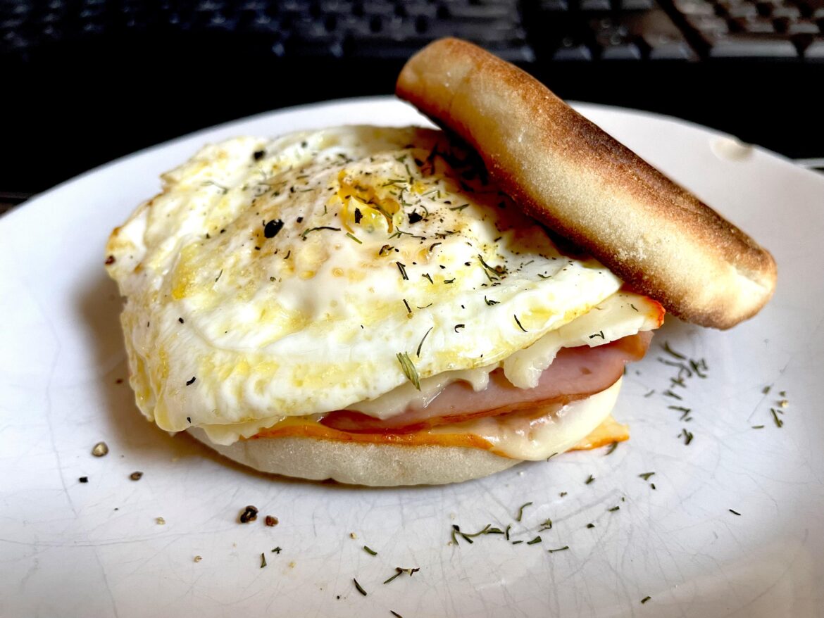 Honey ham, muenster, and an egg on an English muffin