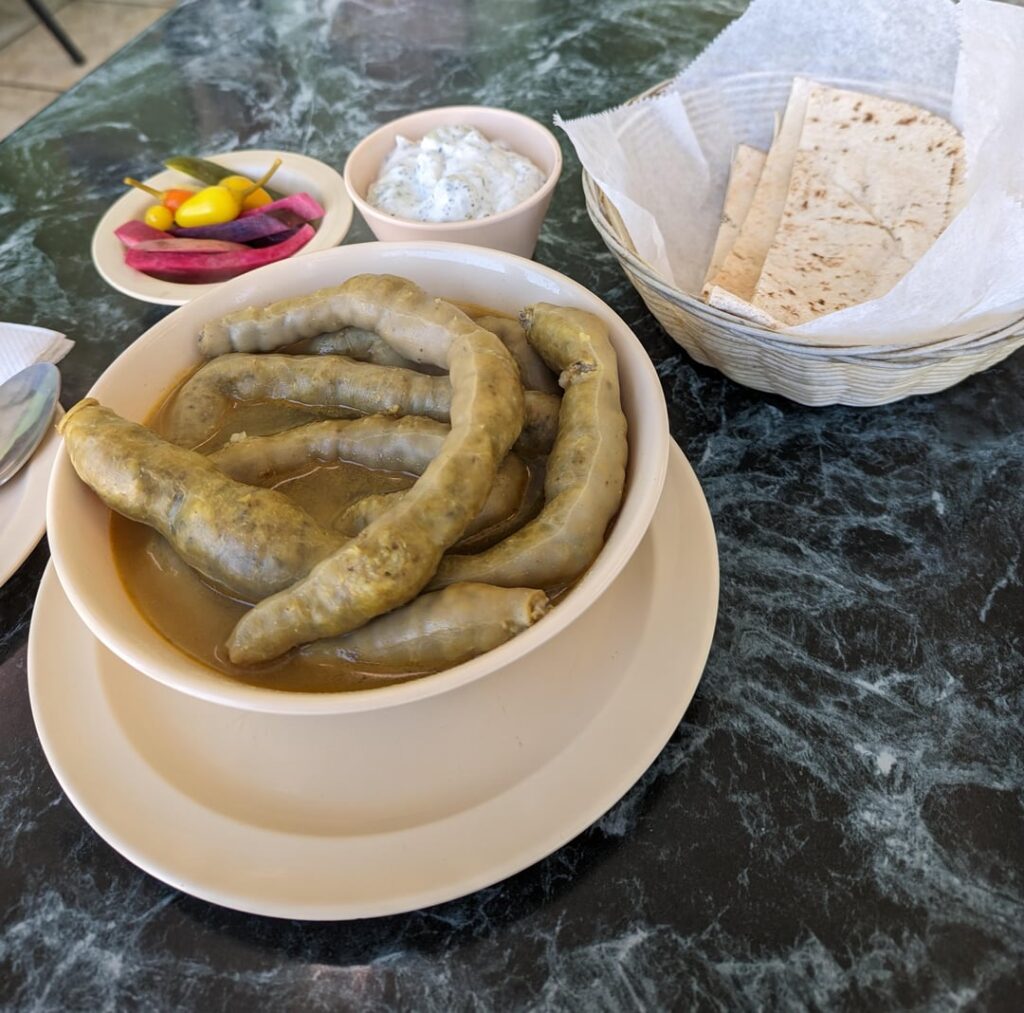 Looks can be deceiving - delicious food from Kobee Factory in Van Nuys! Msaren (stuffed intestines) & fried kobee. More info in the comments!