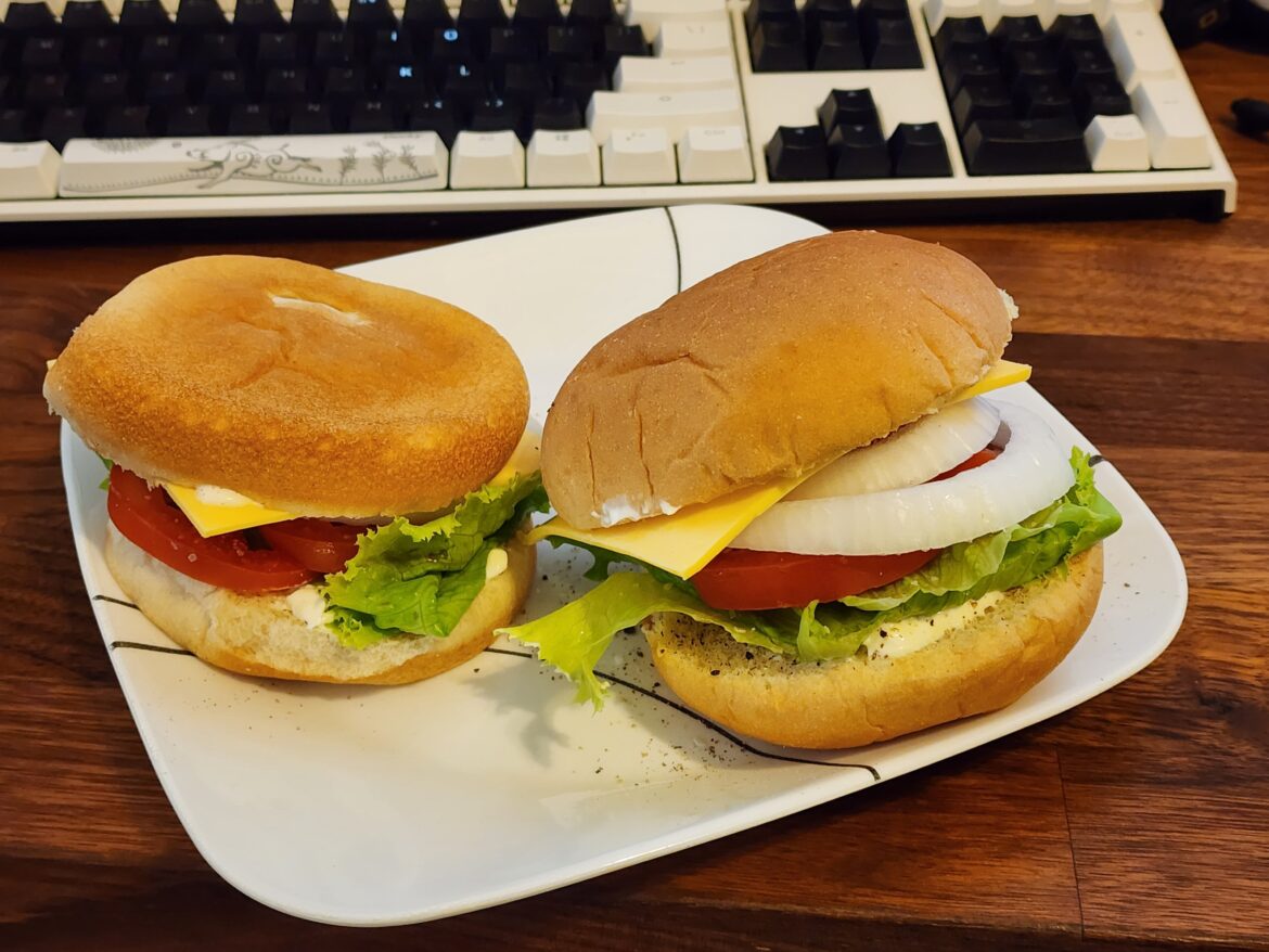 Lettuce, tomato, onion, and cold American cheese with mayo on an untoasted bun