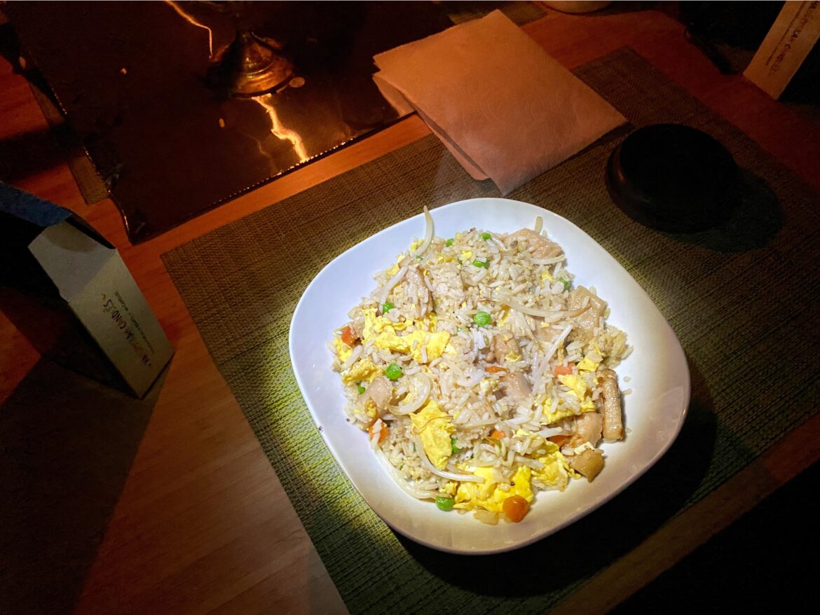 Fried rice prepared by candle and flashlight
