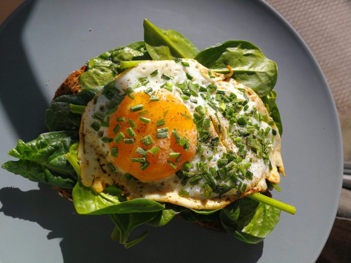 On some toasted bread with spinach