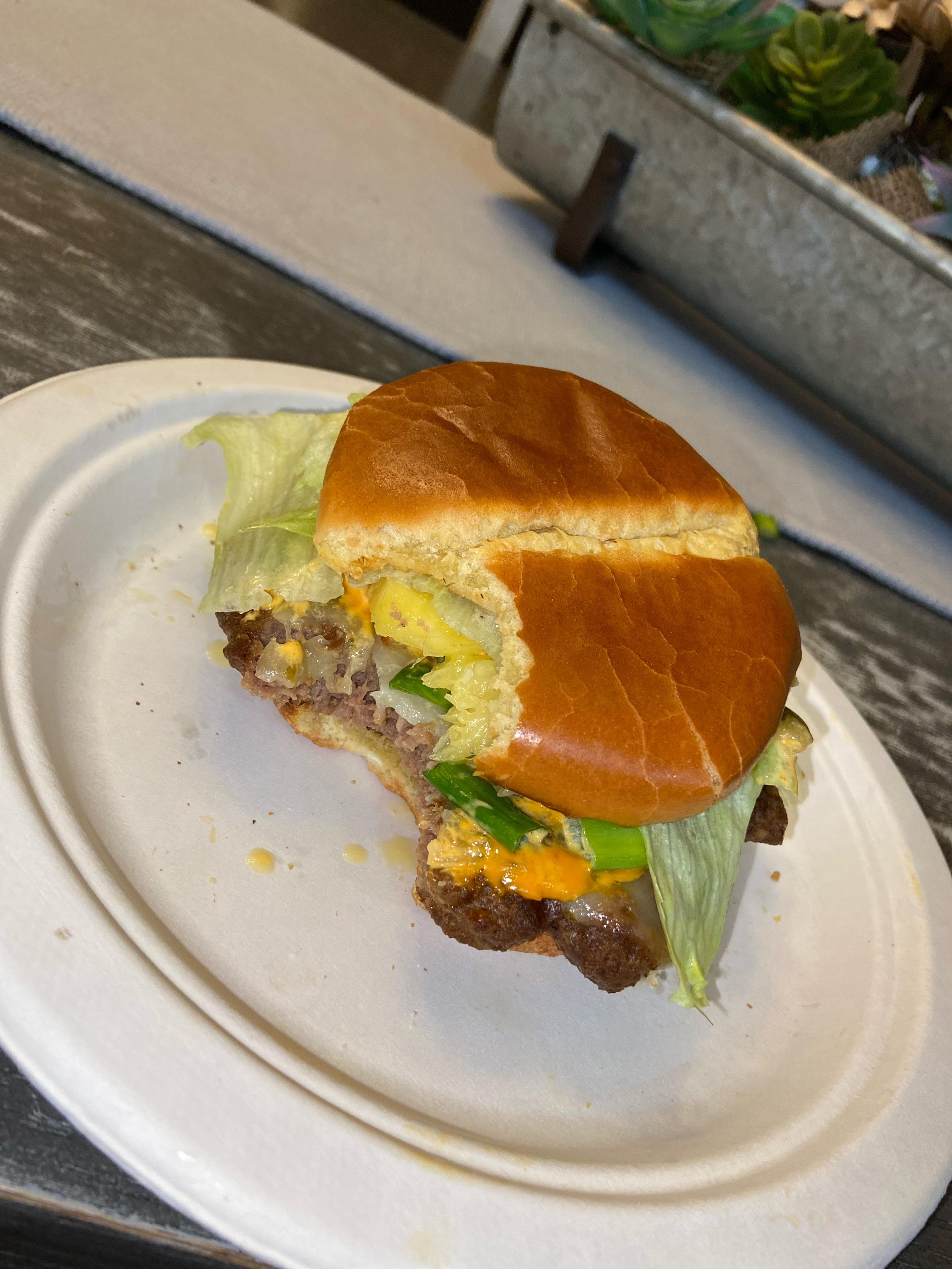 Beef Patty with habanero pepper jack, green onion, pineapple slices, jalapeños, lettuce and