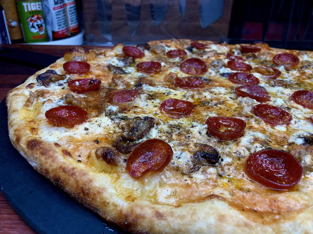 Pizza night! Three cheeses, with a mix of my red sauce and Pecorino cream sauce, sweet Italian