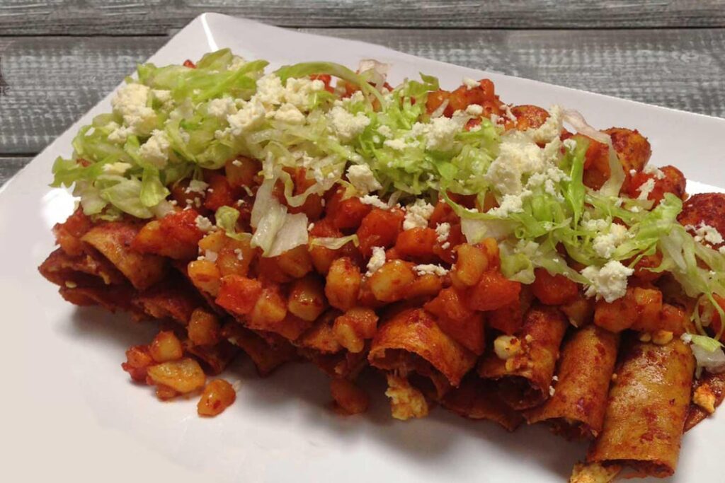 Anyone know where I can get this style of enchiladas in Austin or surrounding areas ? The chopped up carrots and potatoes are important to me. I’m not sure what this style is called.