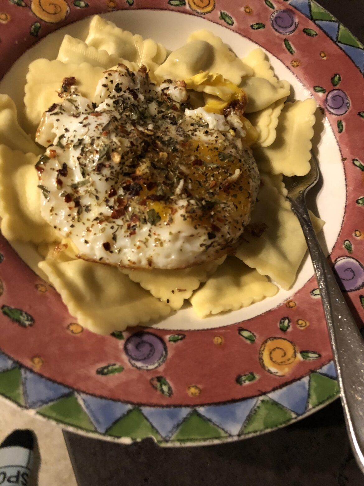 runny yolk egg on top of ravioli