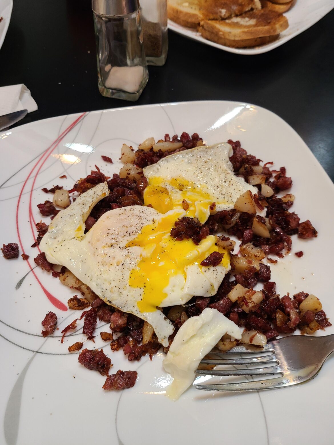 Homemade corned beef hash. Now with 100% more egg!