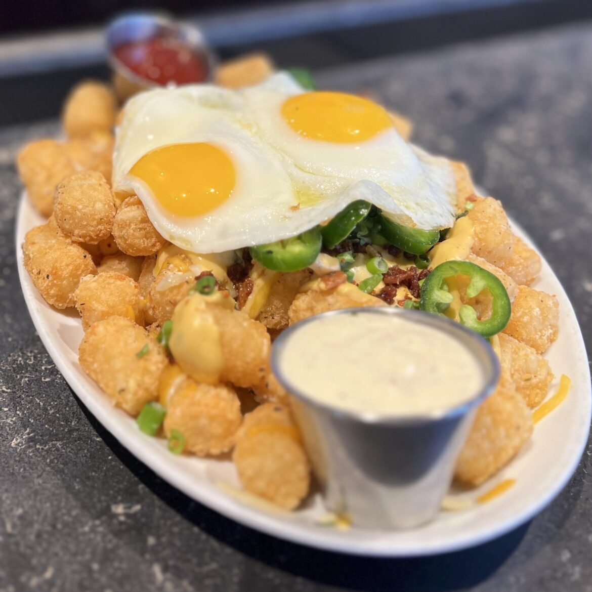 Runny eggs on loaded Tots