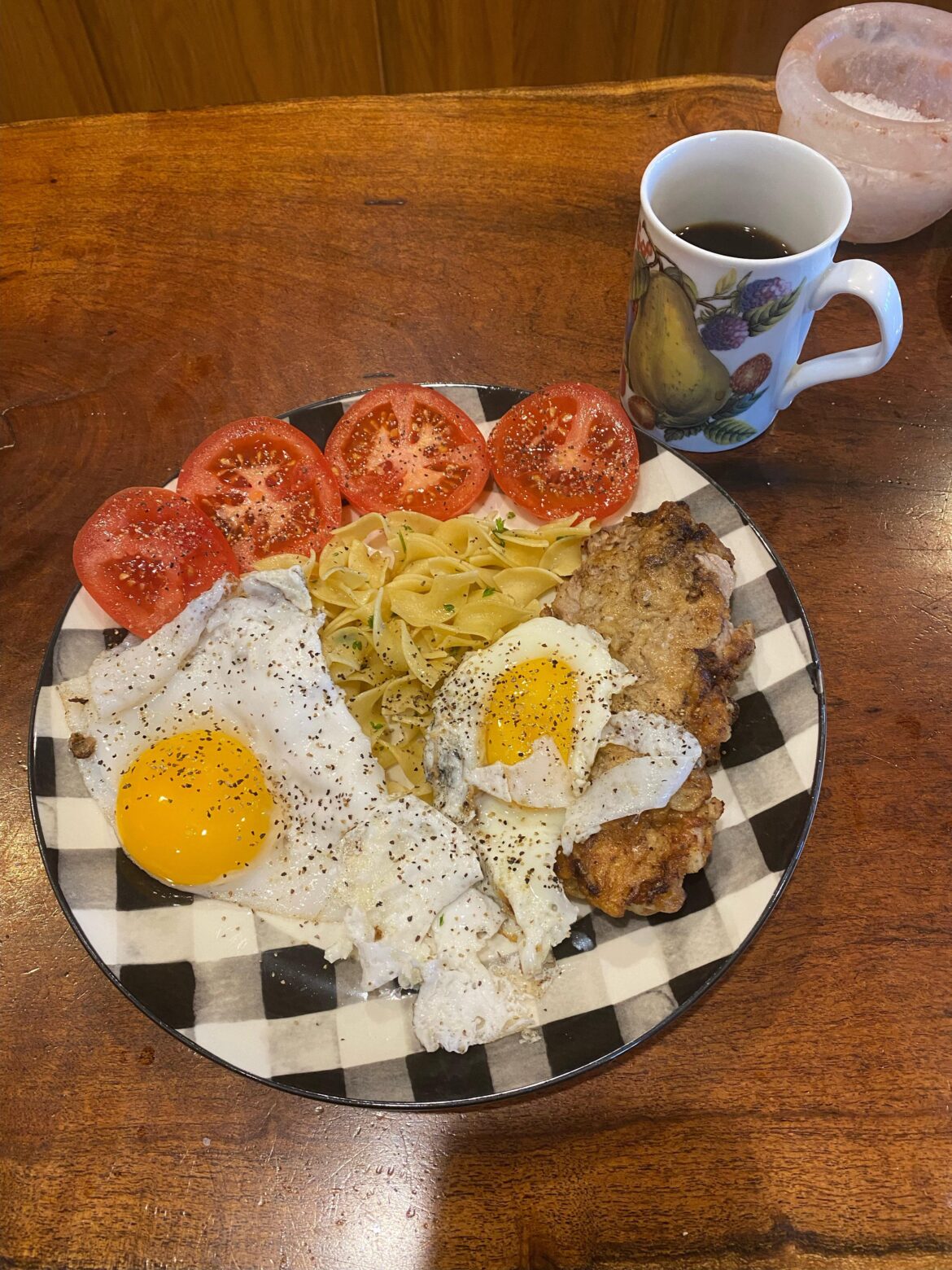 Pork Schnitzel, Noodles, Tomatoes, Eggs - Fella loves his breakfast every morning using our leftovers!