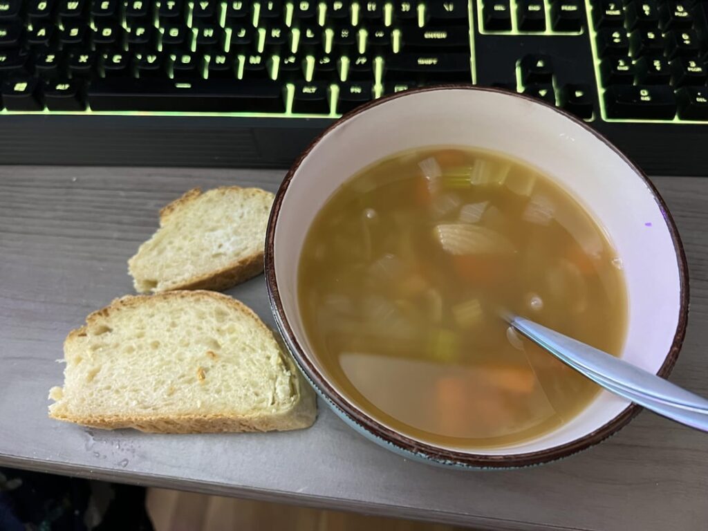 Vegetable and bean soup with baguettes
