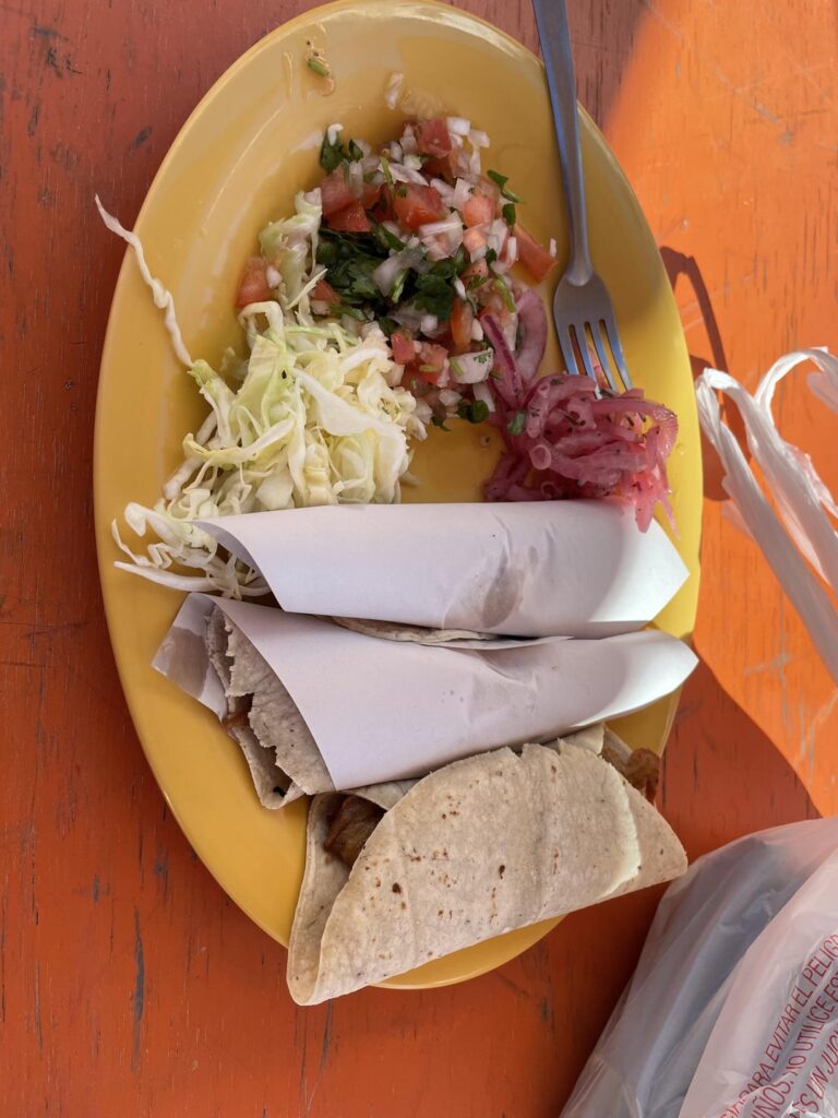 Fish tacos with a side of chorizo tacos in Ensenada Mexico.