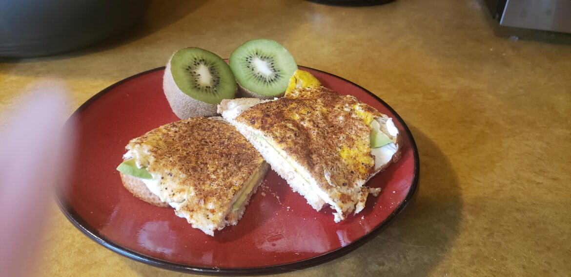 Open faced sandwich on toasted sour dough with cream cheese, avocado and a pan fried egg ☺