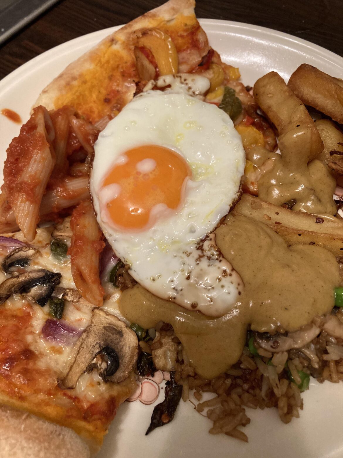 A fried delight atop an orgy of leftovers