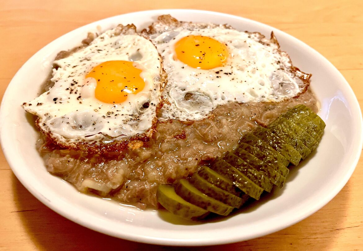 Spanish frikko with fried egg and pickle