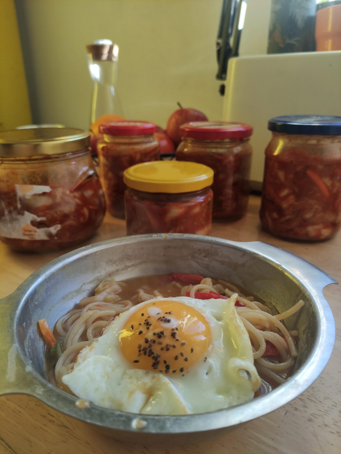 Leftover kimchi pasta with noodles and, of course, an egg on top