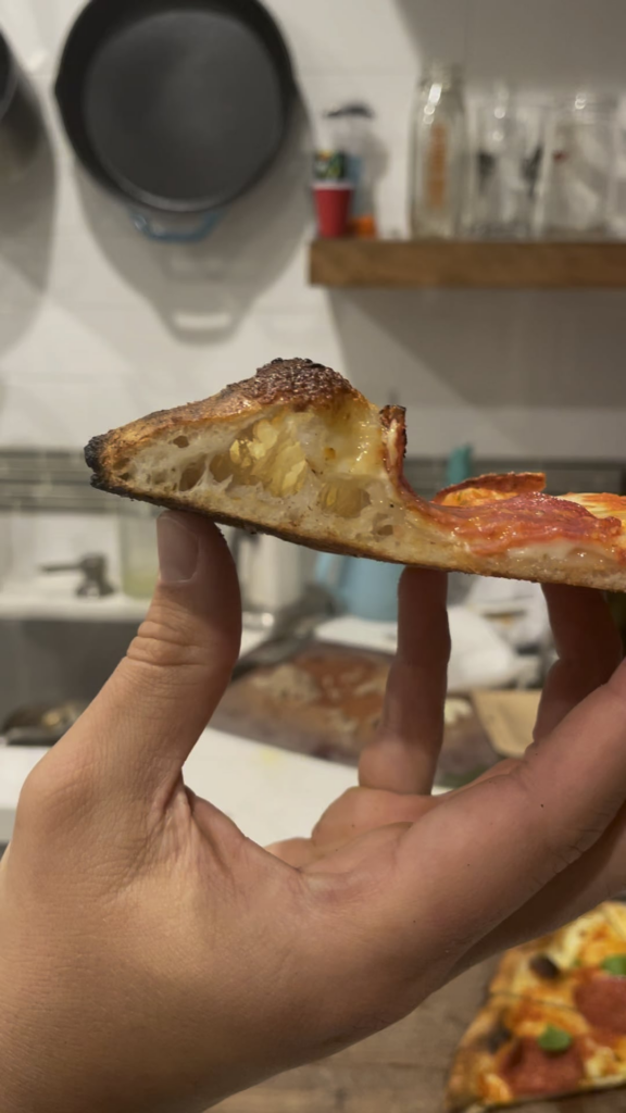 Classic pie with a pepperoni hanging on for dear life