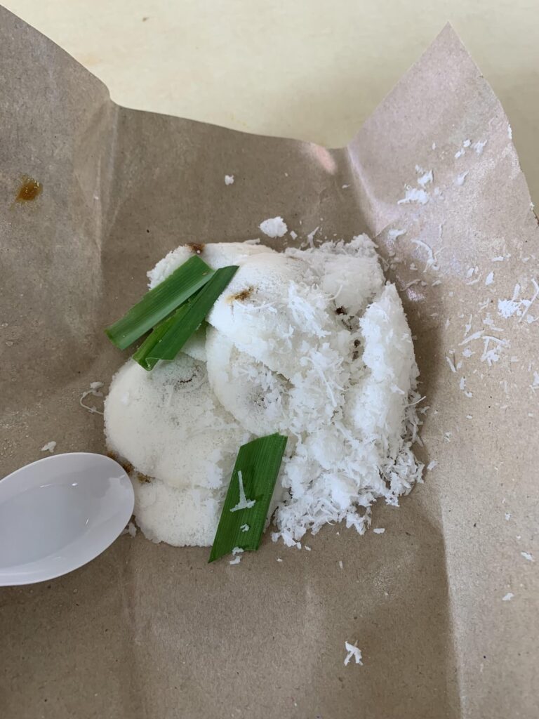 I saw this on Netflix Street Food so I had to try it. Putu piring, a steamed rice cake with palm sugar and pandan leaves at Haig Road Food Centre in Singapore.