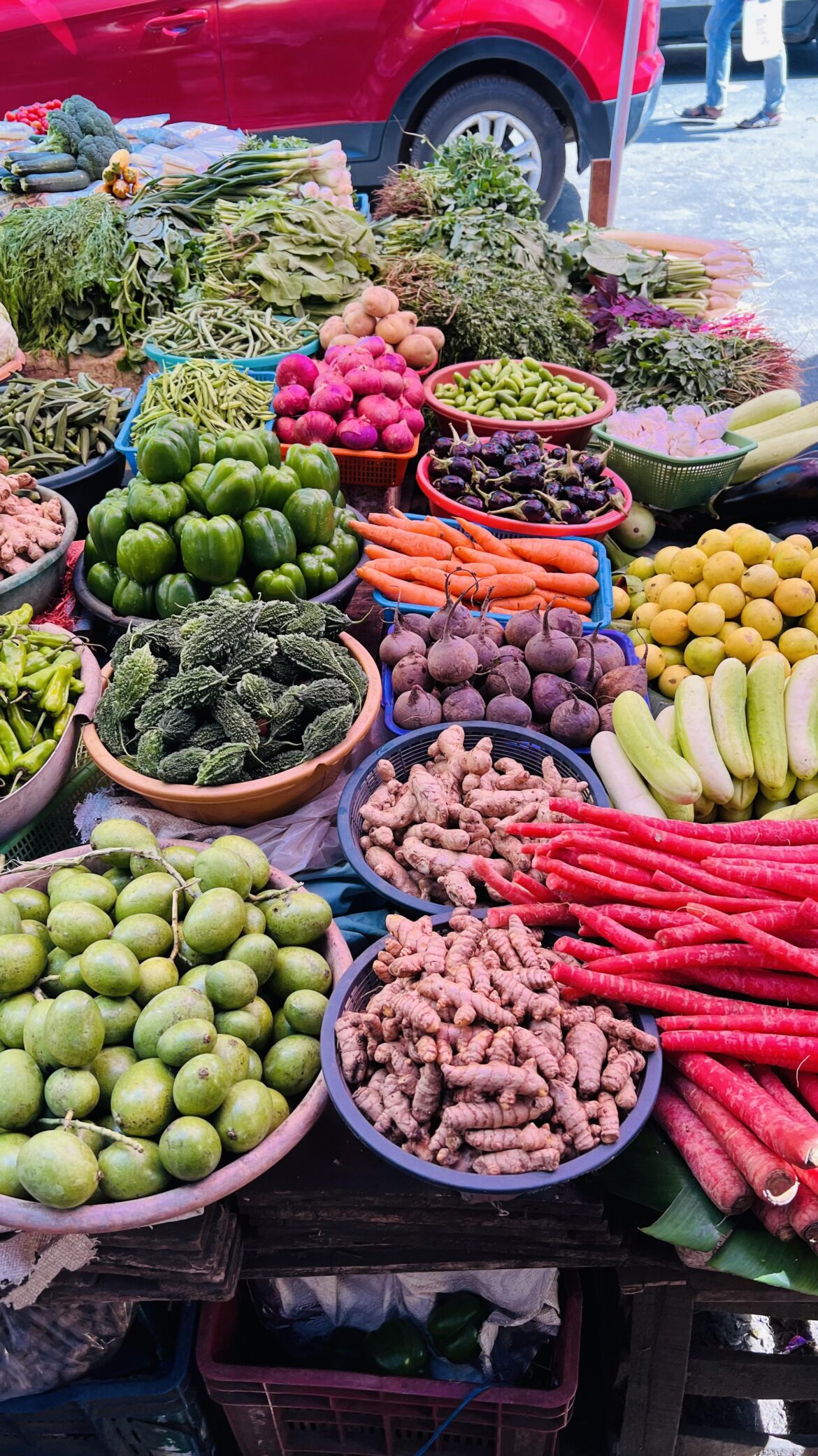At the shop buying vegetables.