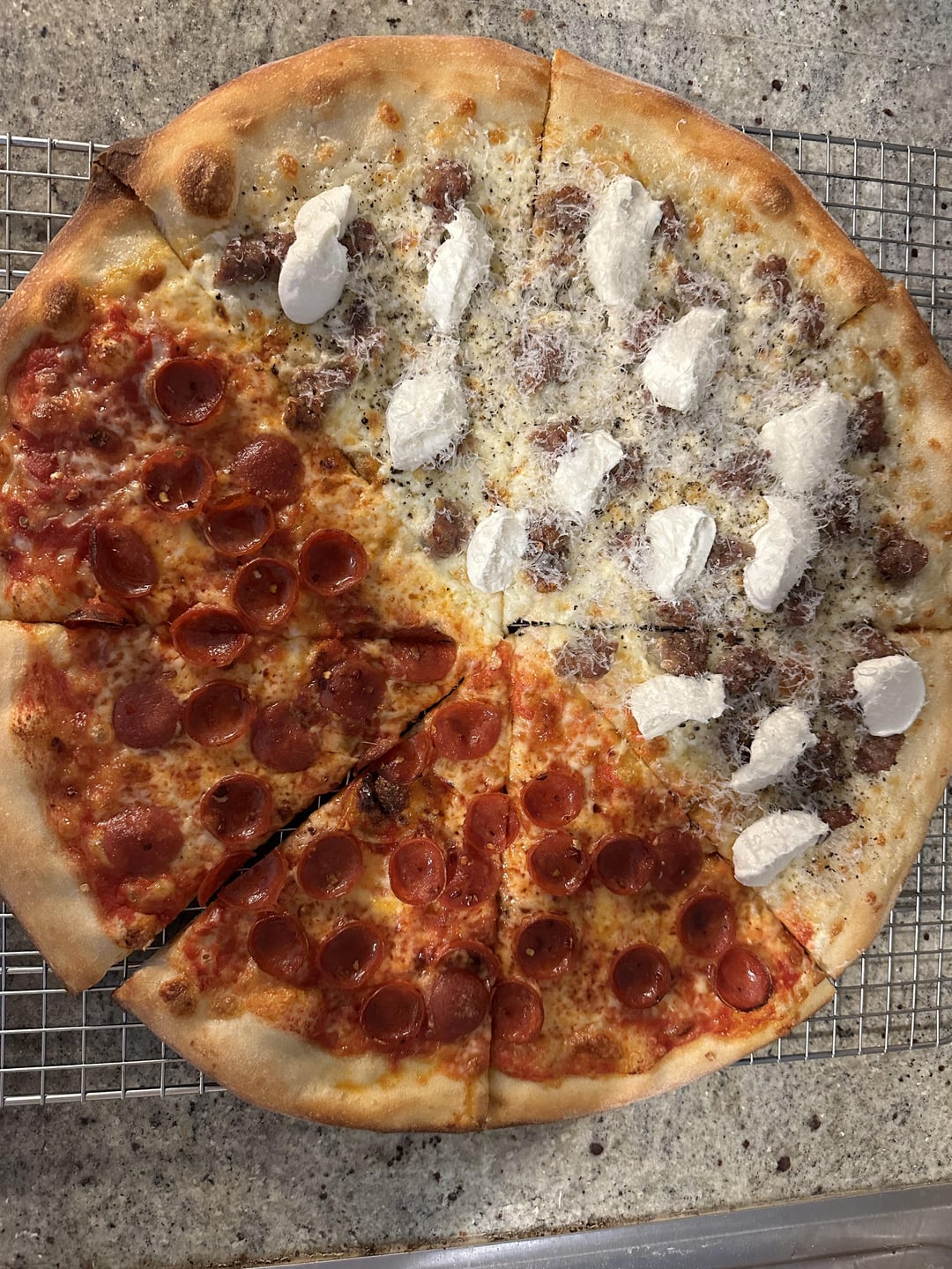 18”. home oven. Half pepperoni and hot honey/white sausage ricotta crème and black pepper